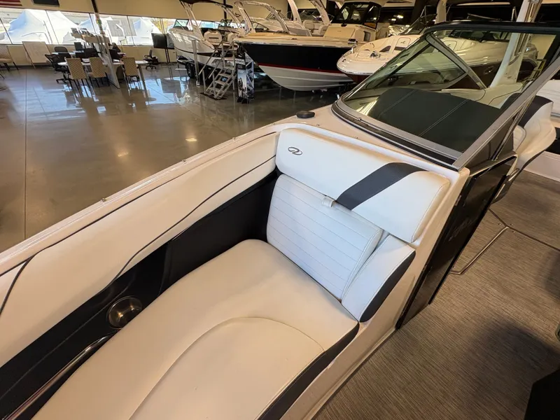 Slide: The Image of 2016 Regal 2300 Bowrider interior with white seating in showroom. - 3