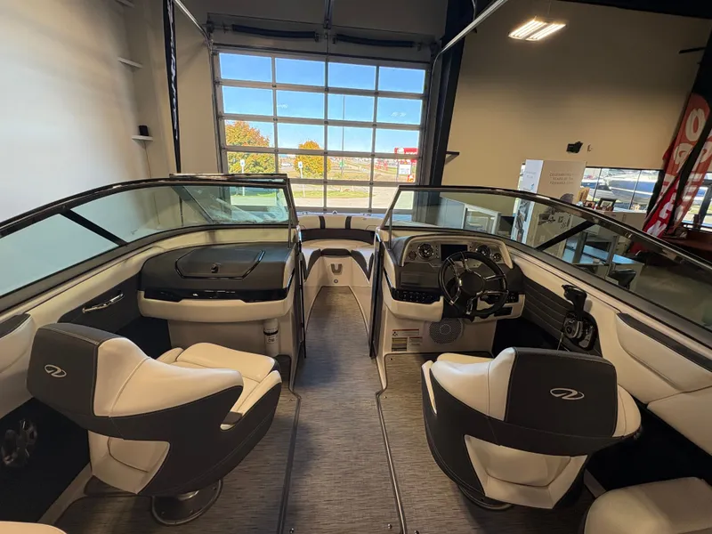 Slide: The Image of Interior of a 2016 Regal 2300 Bowrider boat, featuring sleek seating and modern dashboard. - 4