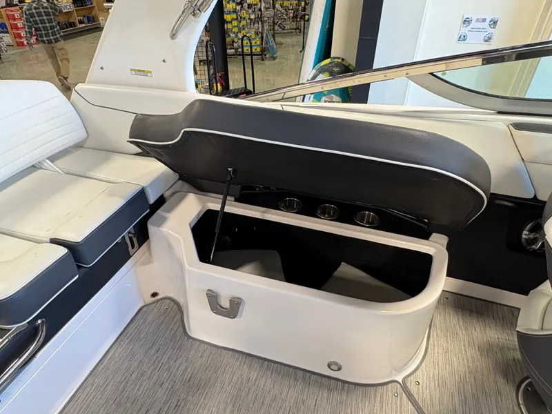 Slide: The Image of 2016 Regal 2300 Bowrider boat interior with open storage compartment and seating. - 6