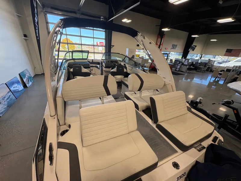 Slide: The Image of 2016 Regal 2300 Bowrider interior with white seating in showroom. - 9