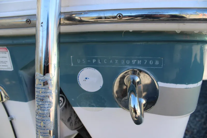 Slide: The Image of Rear view of 2008 Pro-Line 29 Express O/B boat with registration details. - 10