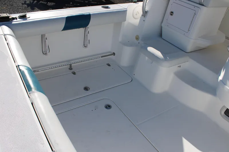 Slide: The Image of 2008 Pro-Line 29 Express O/B boat interior with seating and storage compartments. - 14
