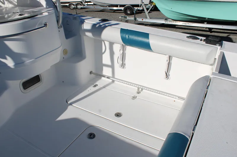 Slide: The Image of 2008 Pro-Line 29 Express O/B boat interior with white and blue seating. - 15