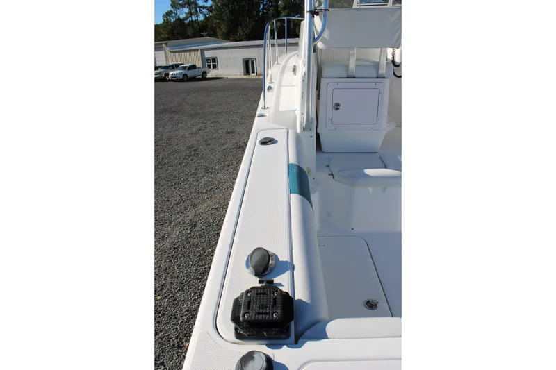 Slide: The Image of 2008 Pro-Line 29 Express O/B boat deck, featuring seating and storage compartments. - 17