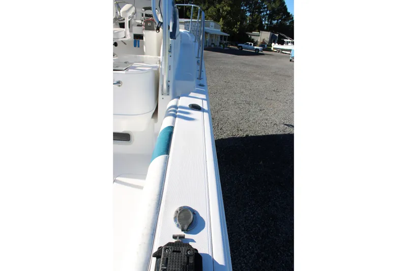 Slide: The Image of 2008 Pro-Line 29 Express O/B boat deck view, showcasing sleek design and outdoor setting. - 19