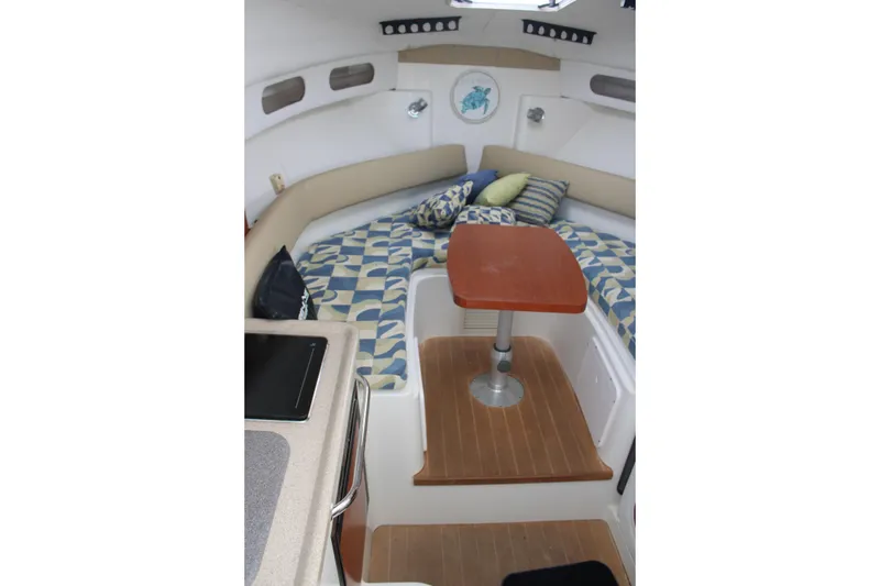Slide: The Image of 2008 Pro-Line 29 Express O/B cabin interior with seating and table. - 25