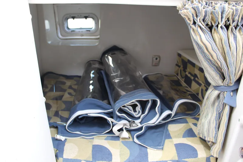 Slide: The Image of Cozy cabin interior of 2008 Pro-Line 29 Express O/B with rolled-up covers. - 27