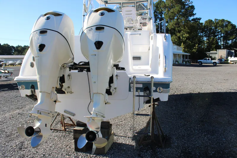 Slide: The Image of 2008 Pro-Line 29 Express O/B boat with dual outboard engines on display. - 5