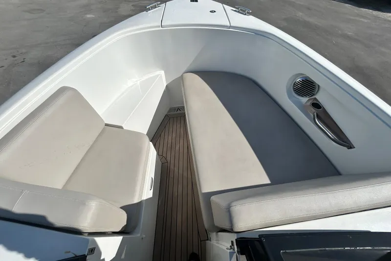 Slide: The Image of Interior of 2022 Rand Supreme 27 boat with cushioned seating and speaker. - 33