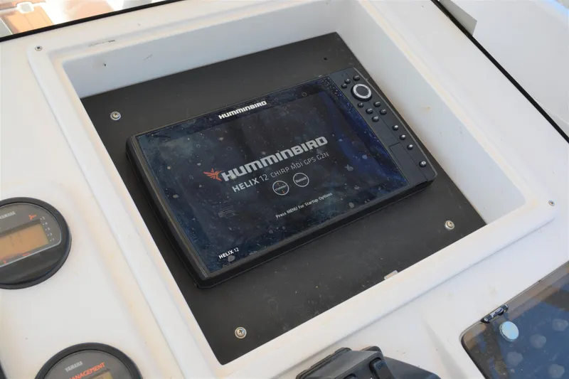 Slide: The Image of Humminbird HELIX 12 GPS unit on 2001 Intrepid 322 Cuddy boat dashboard. - 17