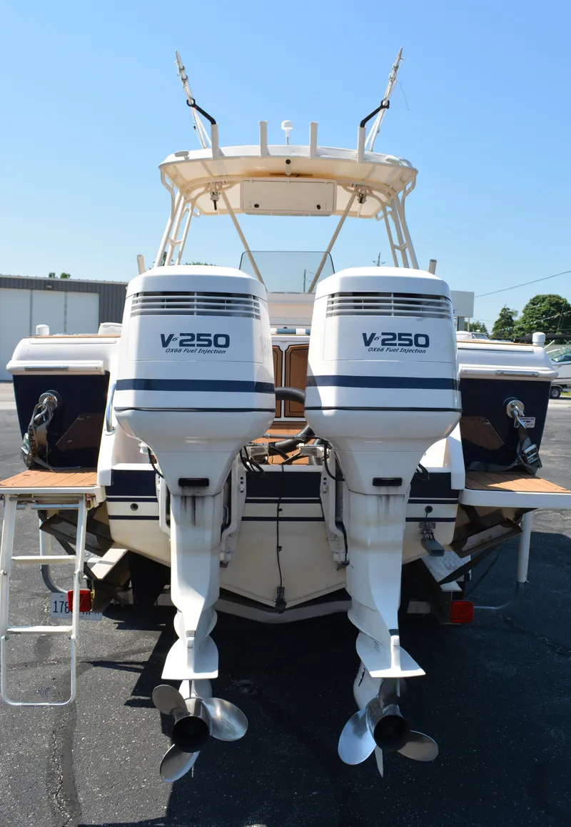Slide: The Image of 2001 Intrepid 322 Cuddy boat with twin V250 engines, rear view. - 3