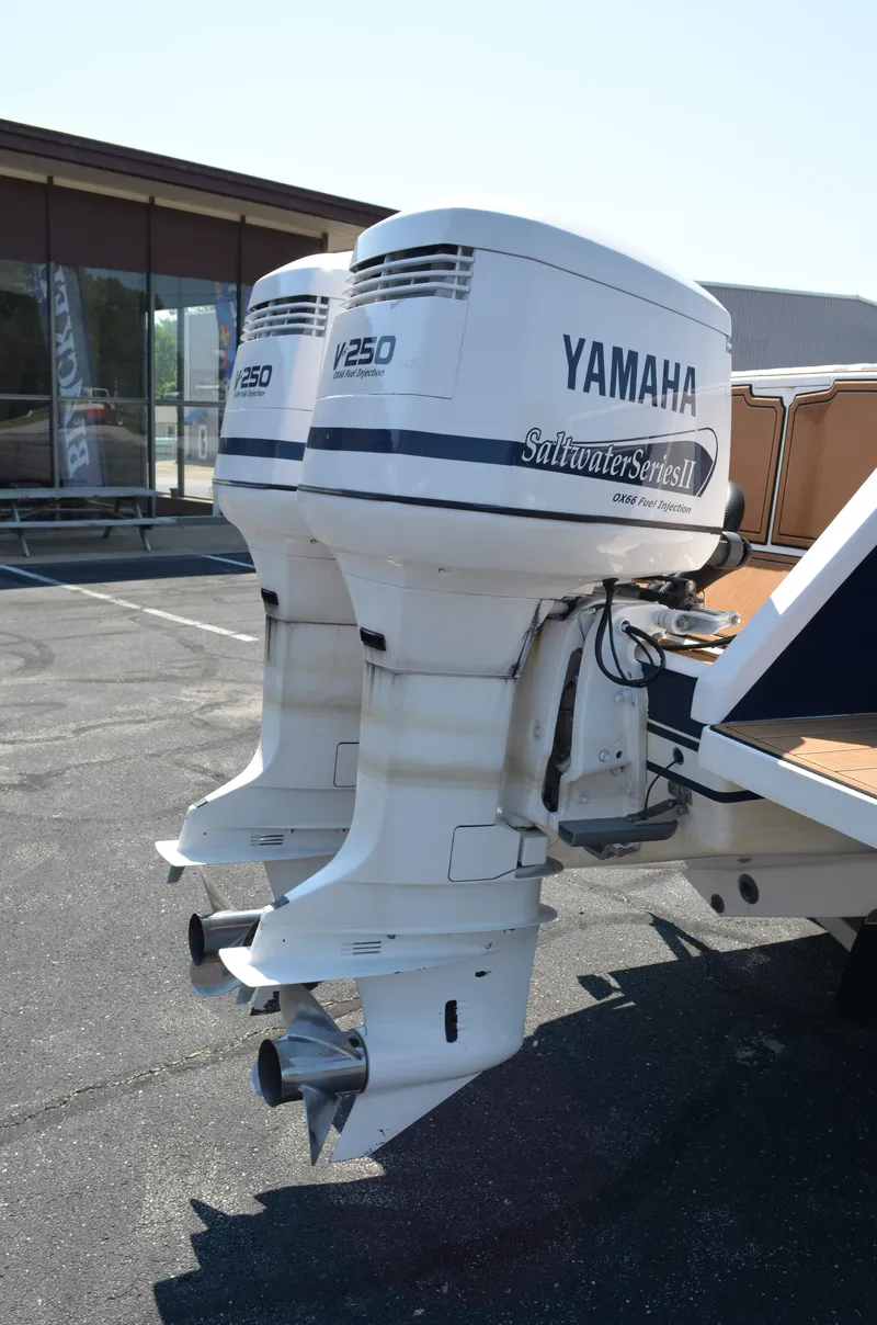 Slide: The Image of Twin Yamaha outboard motors on a 2001 Intrepid 322 Cuddy boat. - 4