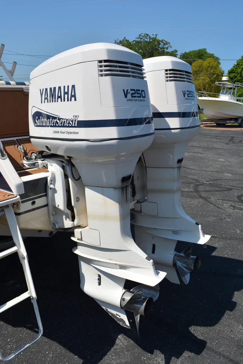 Slide: The Image of Twin Yamaha V250 outboard engines on a 2001 Intrepid 322 Cuddy boat. - 5