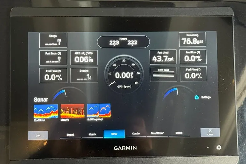 Slide: The Image of Garmin display on 2023 Beneteau Antares 9 showing sonar and fuel data. - 11