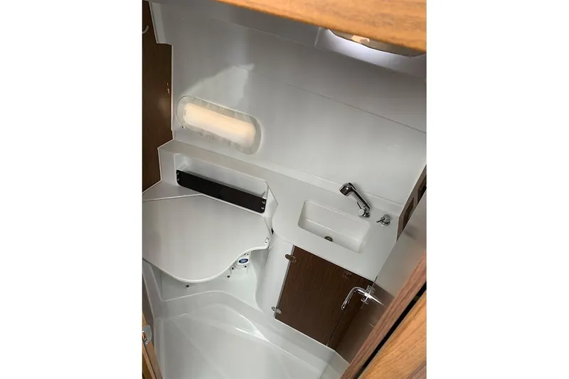 Slide: The Image of 2023 Beneteau Antares 9 bathroom interior with sink and storage. - 15