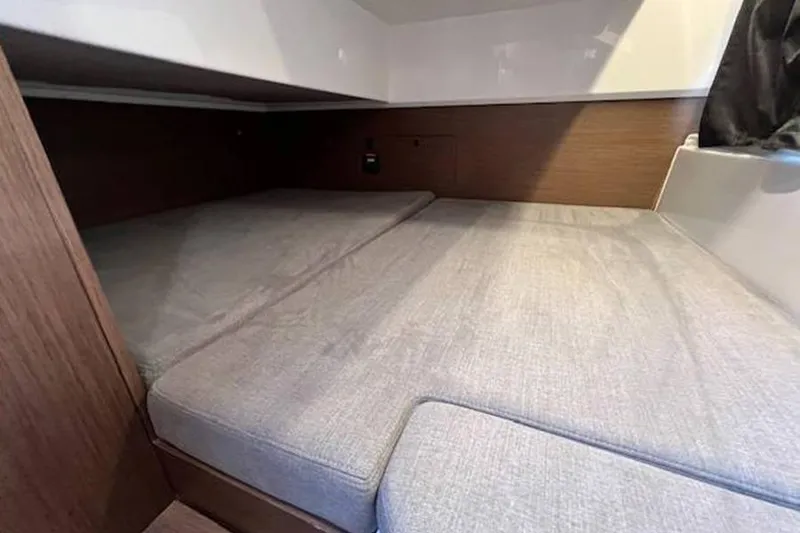 Slide: The Image of 2023 Beneteau Antares 9 cabin interior with comfortable bedding. - 18