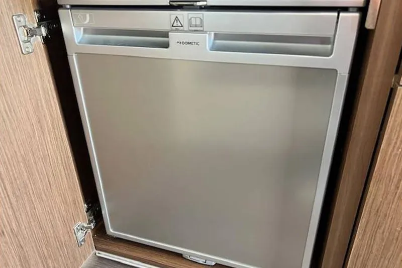 Slide: The Image of Built-in Dometic fridge in 2023 Beneteau Antares 9 boat interior. - 20