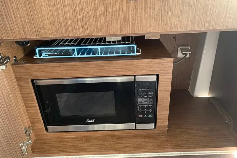 Slide: The Image of Microwave in 2023 Beneteau Antares 9 boat kitchen cabinet. - 22