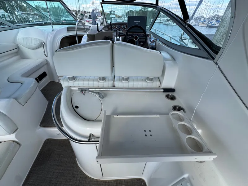 Slide: The Image of 2001 Maxum 3500 SCR yacht interior with helm, seating, and cup holders. - 10