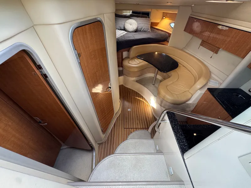 Slide: The Image of 2001 Maxum 3500 SCR yacht interior with cozy seating, wooden accents, and modern design. - 17