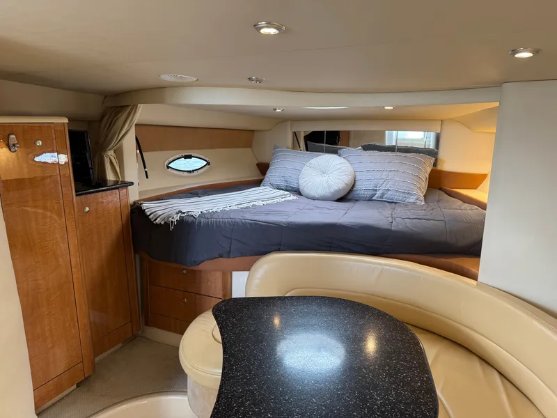 Slide: The Image of Interior of 2001 Maxum 3500 SCR yacht with cozy bed and elegant seating area. - 18