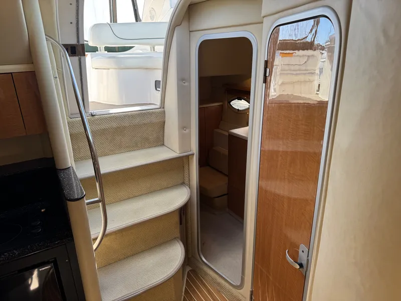 Slide: The Image of Interior of 2001 Maxum 3500 SCR yacht with stairs and cabin view. - 22