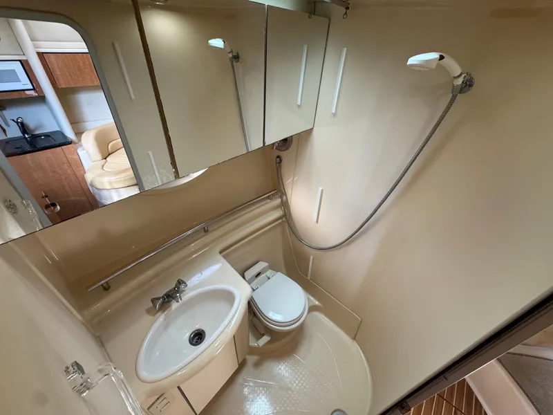 Slide: The Image of 2001 Maxum 3500 SCR yacht bathroom with shower, sink, and toilet. - 23