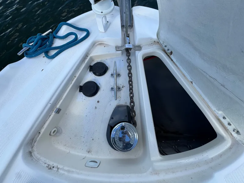 Slide: The Image of Anchor chain and storage compartment on 2001 Maxum 3500 SCR boat deck. - 31