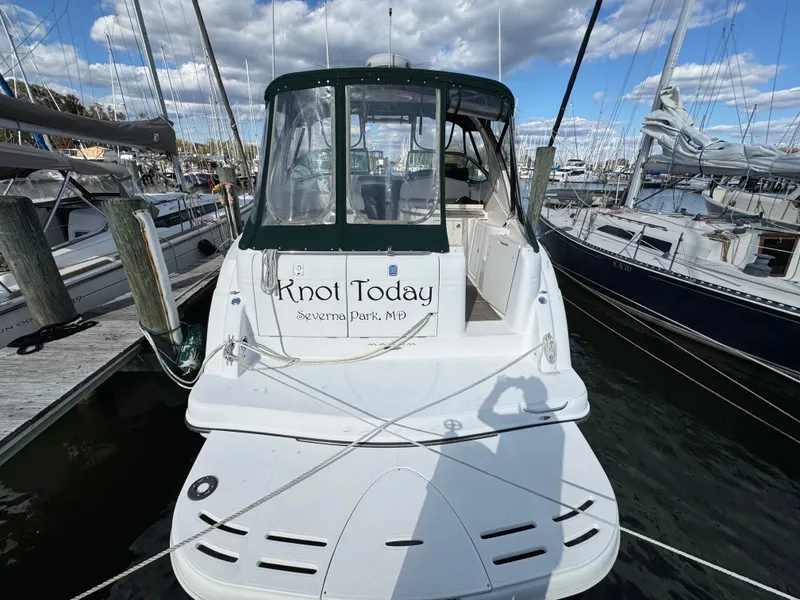 Slide: The Image of 2001 Maxum 3500 SCR boat named "Knot Today" docked at marina. - 5