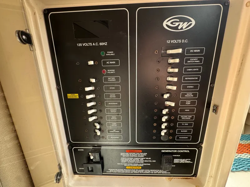 Slide: The Image of Electrical control panel on a 2004 Grady-White Marlin 300 boat. - 25