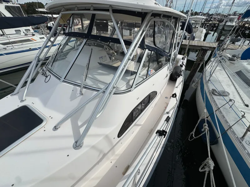 Slide: The Image of 2004 Grady-White Marlin 300 boat docked at marina, featuring sleek design and sturdy build. - 33