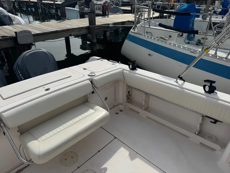 Slide: The Image of 2004 Grady-White Marlin 300 boat interior with seating, docked at marina. - 6