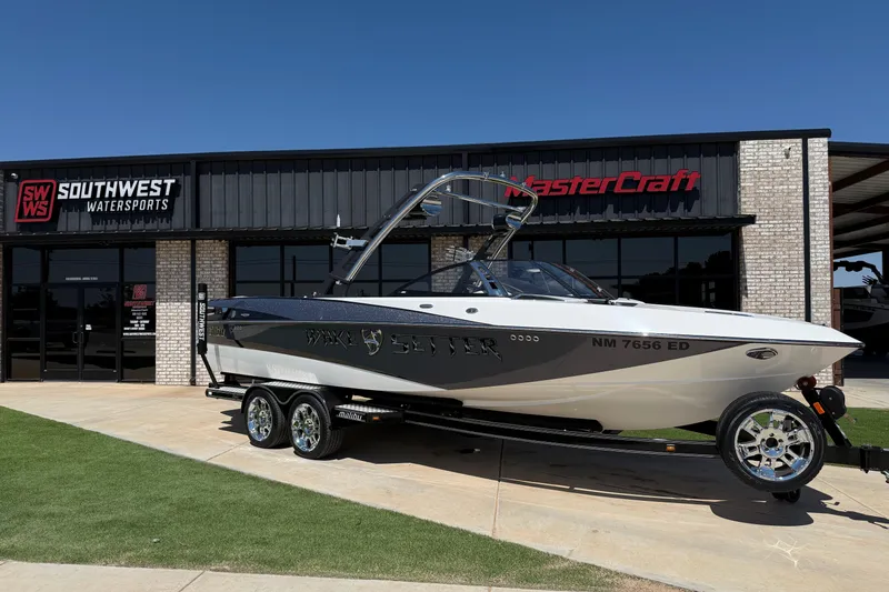 Slide: The Image of 2011 Malibu Wakesetter 247 LSV boat on trailer at Southwest Watersports dealership. - 1