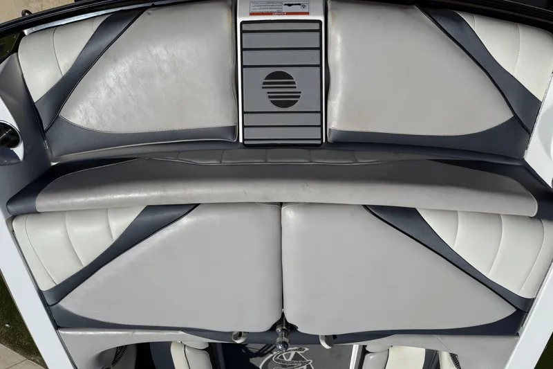 Slide: The Image of 2011 Malibu Wakesetter 247 LSV boat interior with gray and white seating. - 10