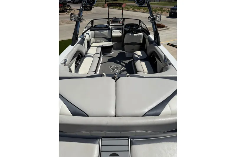 Slide: The Image of 2011 Malibu Wakesetter 247 LSV interior with spacious seating and sleek design. - 11