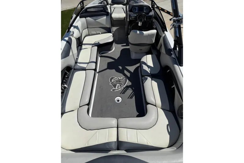 Slide: The Image of 2011 Malibu Wakesetter 247 LSV interior with spacious seating and sleek design. - 12