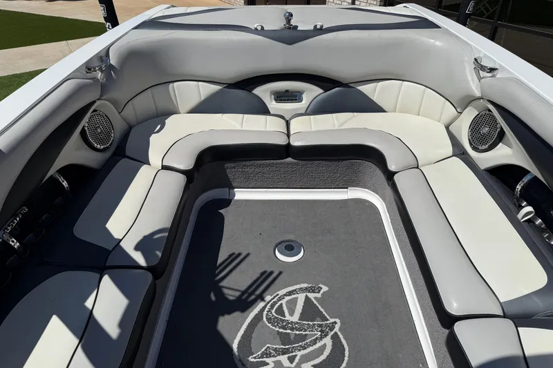 Slide: The Image of 2011 Malibu Wakesetter 247 LSV interior with cushioned seating and speakers. - 14