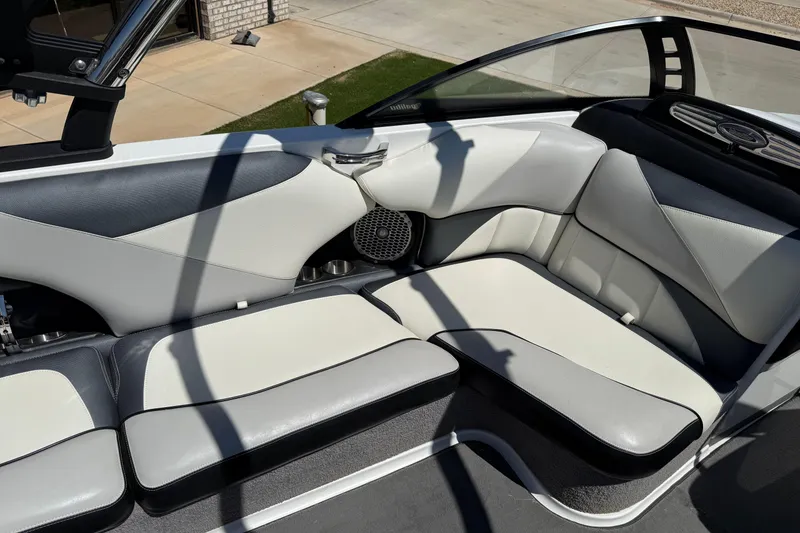 Slide: The Image of 2011 Malibu Wakesetter 247 LSV interior with white and gray seating. - 15