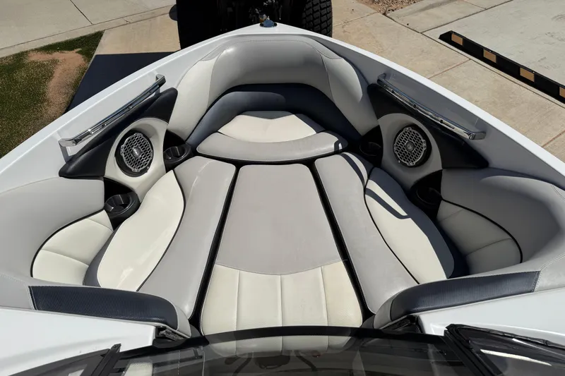 Slide: The Image of 2011 Malibu Wakesetter 247 LSV boat interior with cushioned seating and speakers. - 17