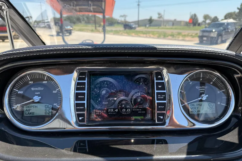 Slide: The Image of Dashboard of a 2011 Malibu Wakesetter 247 LSV boat with gauges and digital display. - 19