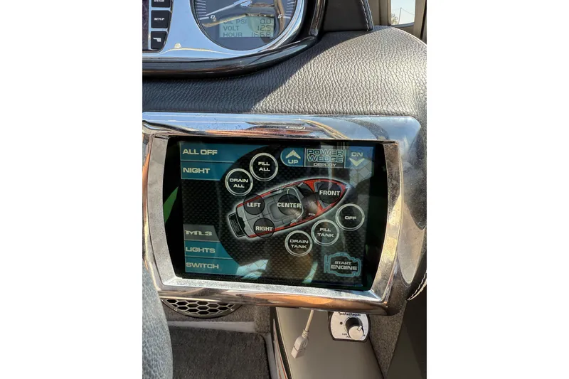 Slide: The Image of Touchscreen control panel in a 2011 Malibu Wakesetter 247 LSV boat dashboard. - 20