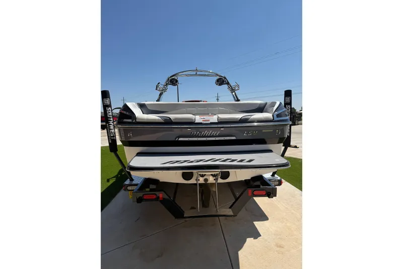 Slide: The Image of 2011 Malibu Wakesetter 247 LSV boat, rear view, parked on concrete. - 5