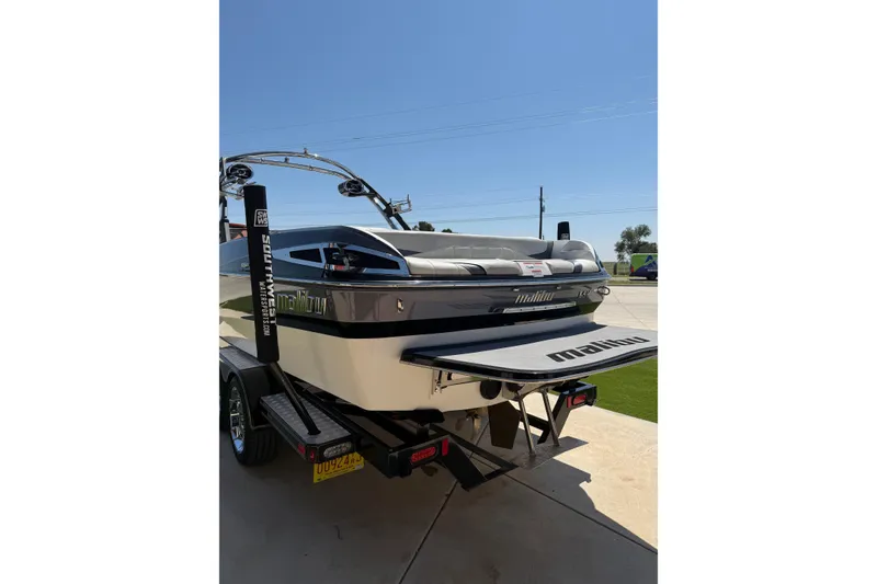 Slide: The Image of 2011 Malibu Wakesetter 247 LSV boat on trailer, rear view, sunny day. - 6