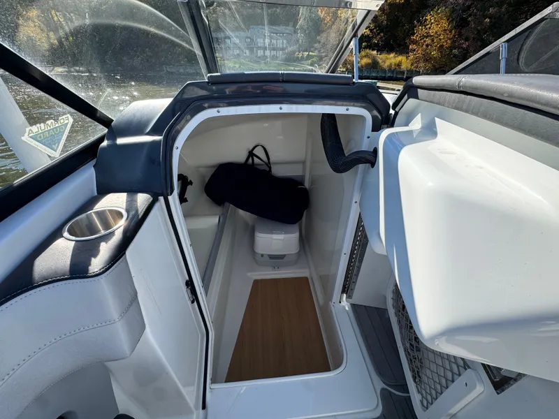 Slide: The Image of 2014 Formula 270 Bowrider interior cabin with storage and seating area. - 12