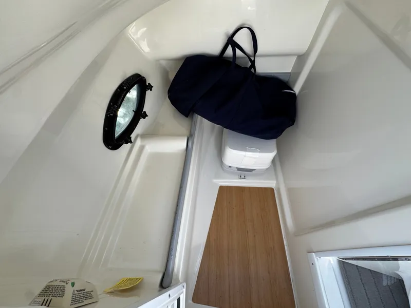 Slide: The Image of Interior cabin of 2014 Formula 270 Bowrider with porthole and storage bag. - 13