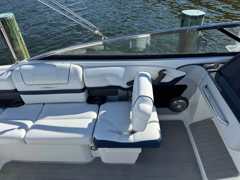 Slide: The Image of 2014 Formula 270 Bowrider interior with white seating and water view. - 16
