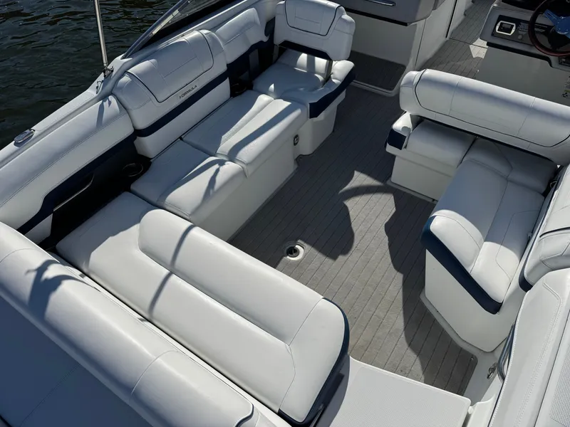 Slide: The Image of 2014 Formula 270 Bowrider interior with spacious white seating and sleek design. - 22