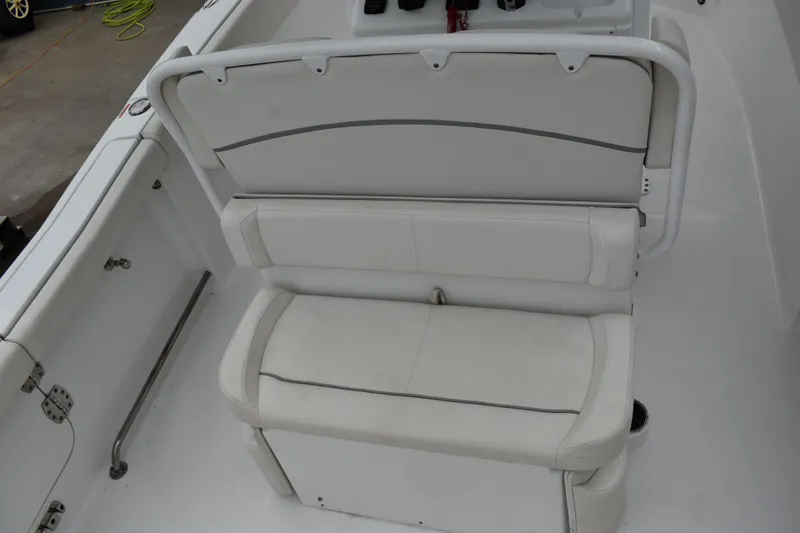 Slide: The Image of 2023 Sea Hunt Ultra 255 SE boat interior seating, white upholstery, modern design. - 16