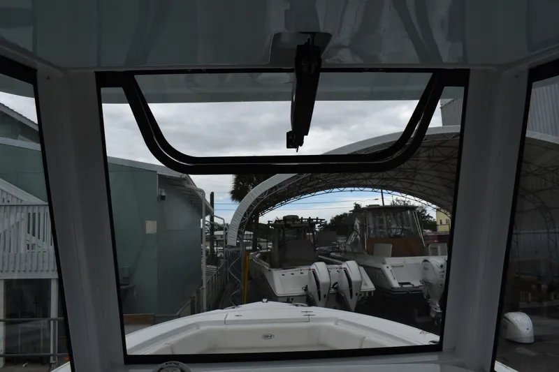 Slide: The Image of 2023 Sea Hunt Ultra 255 SE boat interior view through windshield. - 22