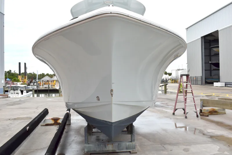 Slide: The Image of 2023 Sea Hunt Ultra 255 SE boat on dry dock, front view. - 3